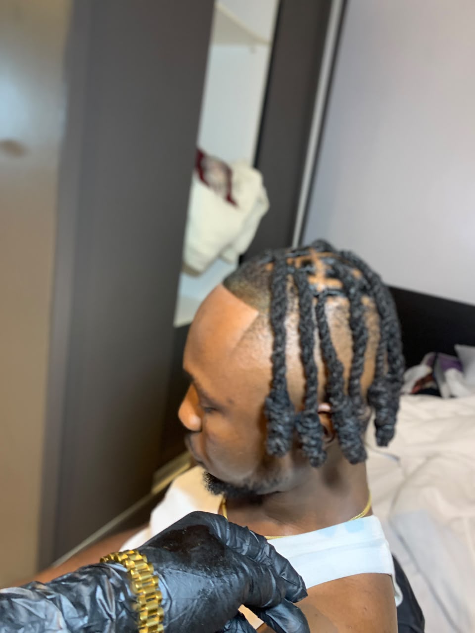 Side view of shoulder-length braids